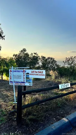 a view of a wooden floor and a bench in a yard