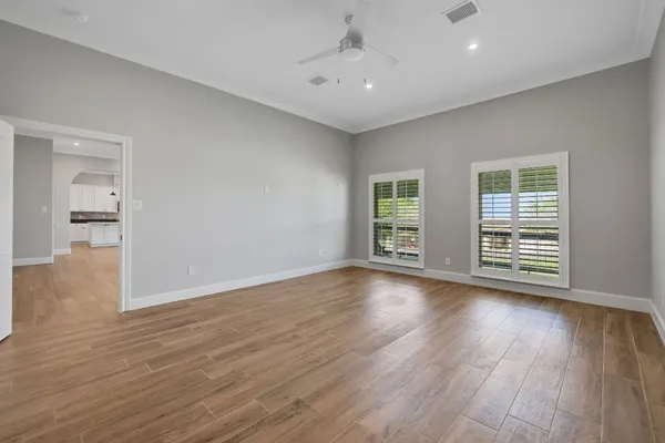 a bedroom with a bed and a lamp