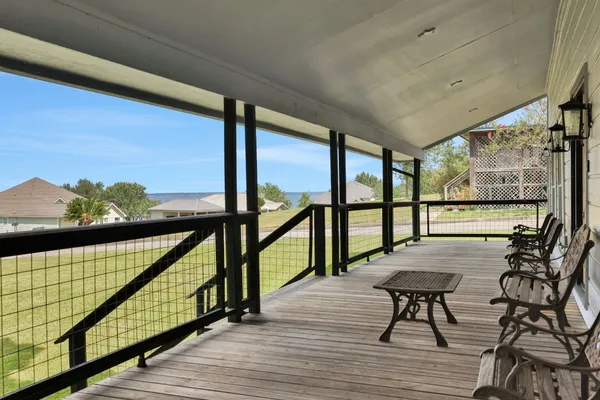 a view of a room with wooden floor and balcony