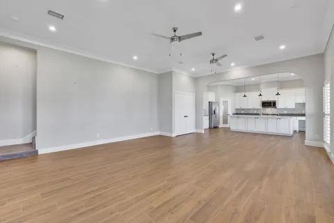 a view of kitchen with wooden floor and window