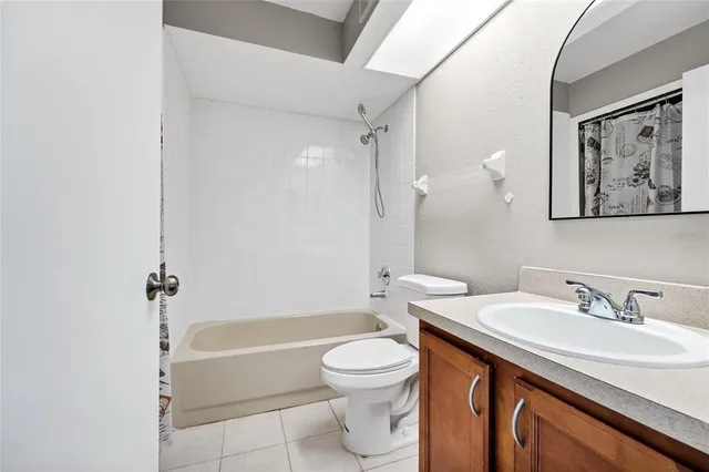 a bathroom with a sink a toilet and a bathtub