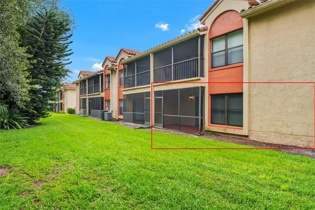 a view of a house with backyard and porch