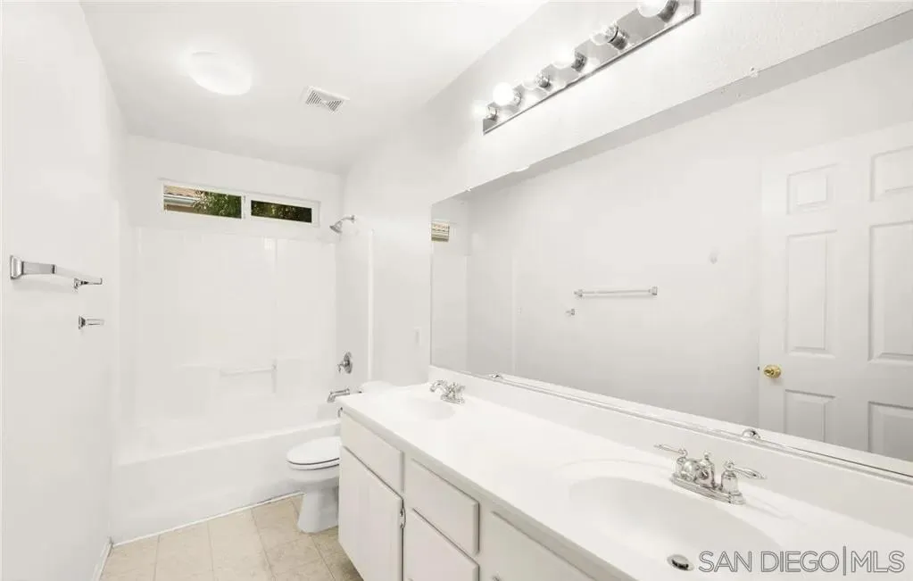 46197 Via La Tranquila Temecula, CA 92592 - Photo 13 of 20 a bathroom with a sink a toilet and shower