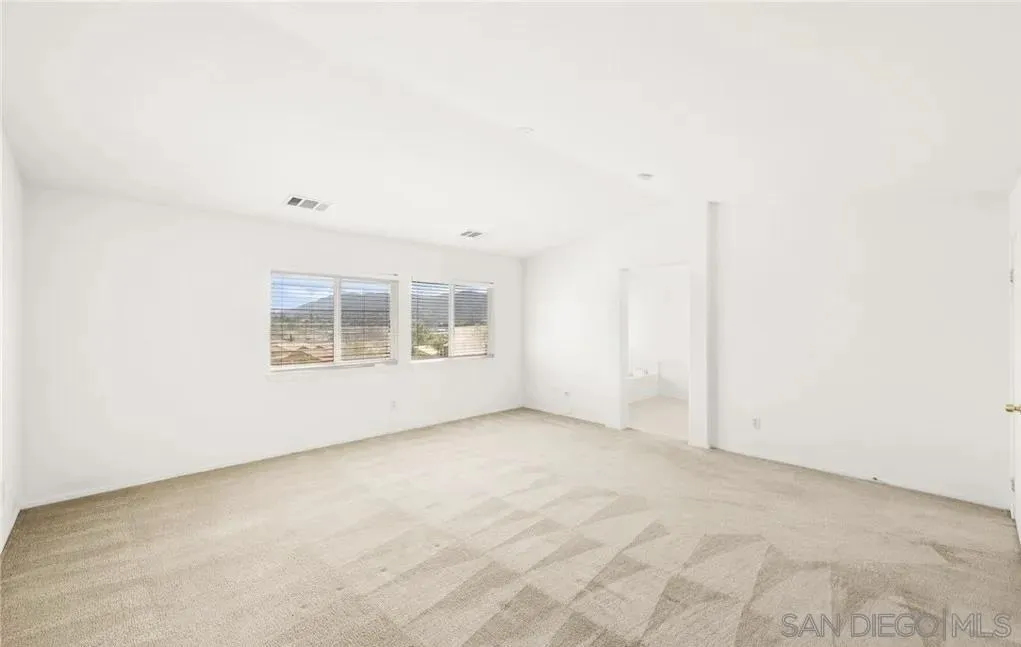 46197 Via La Tranquila Temecula, CA 92592 - Photo 16 of 20 an empty room with windows