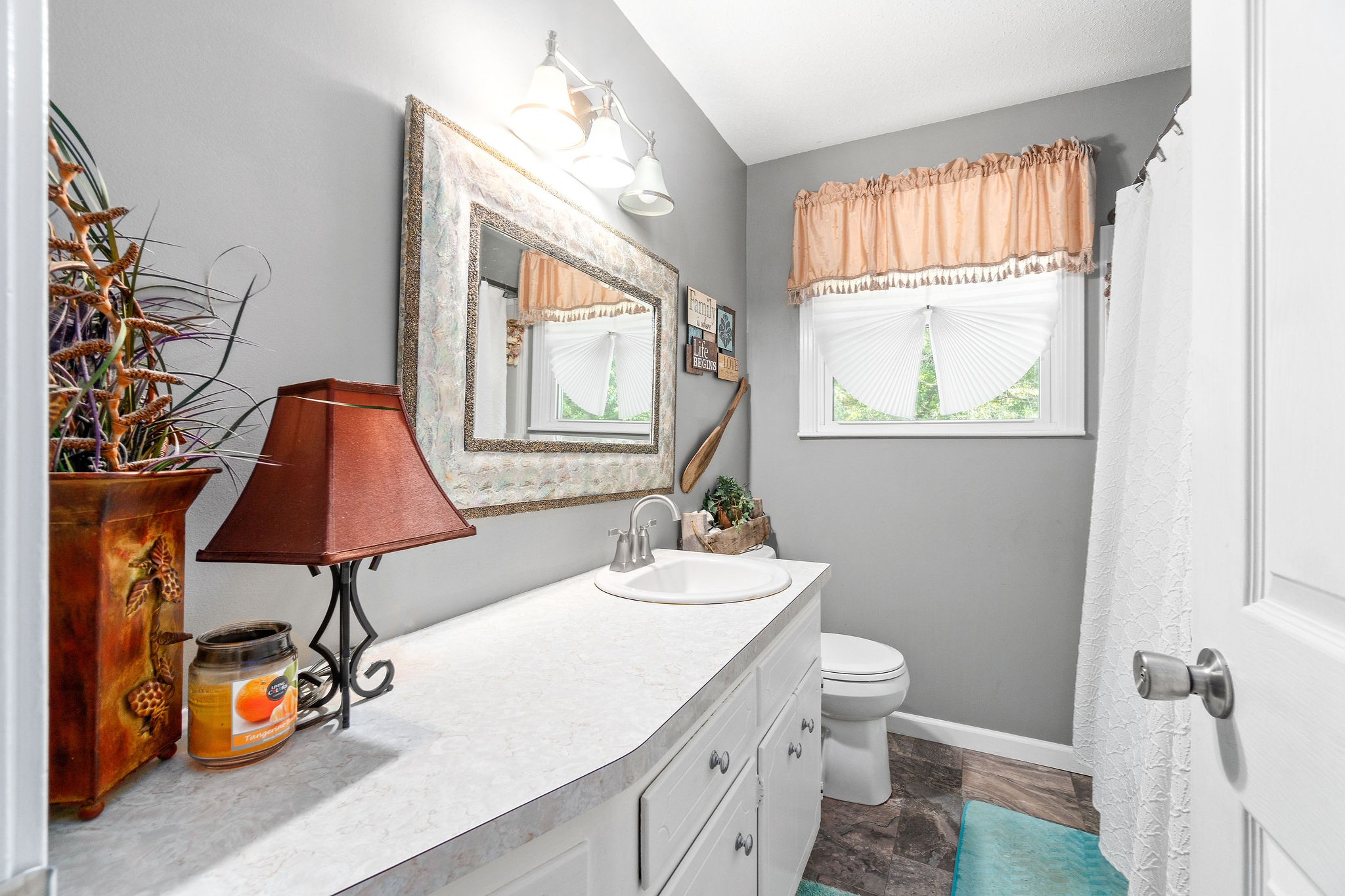 333 Dean Road Clarksville, TN 37040 - Photo 21 of 30 a bathroom with a sink a toilet and a window