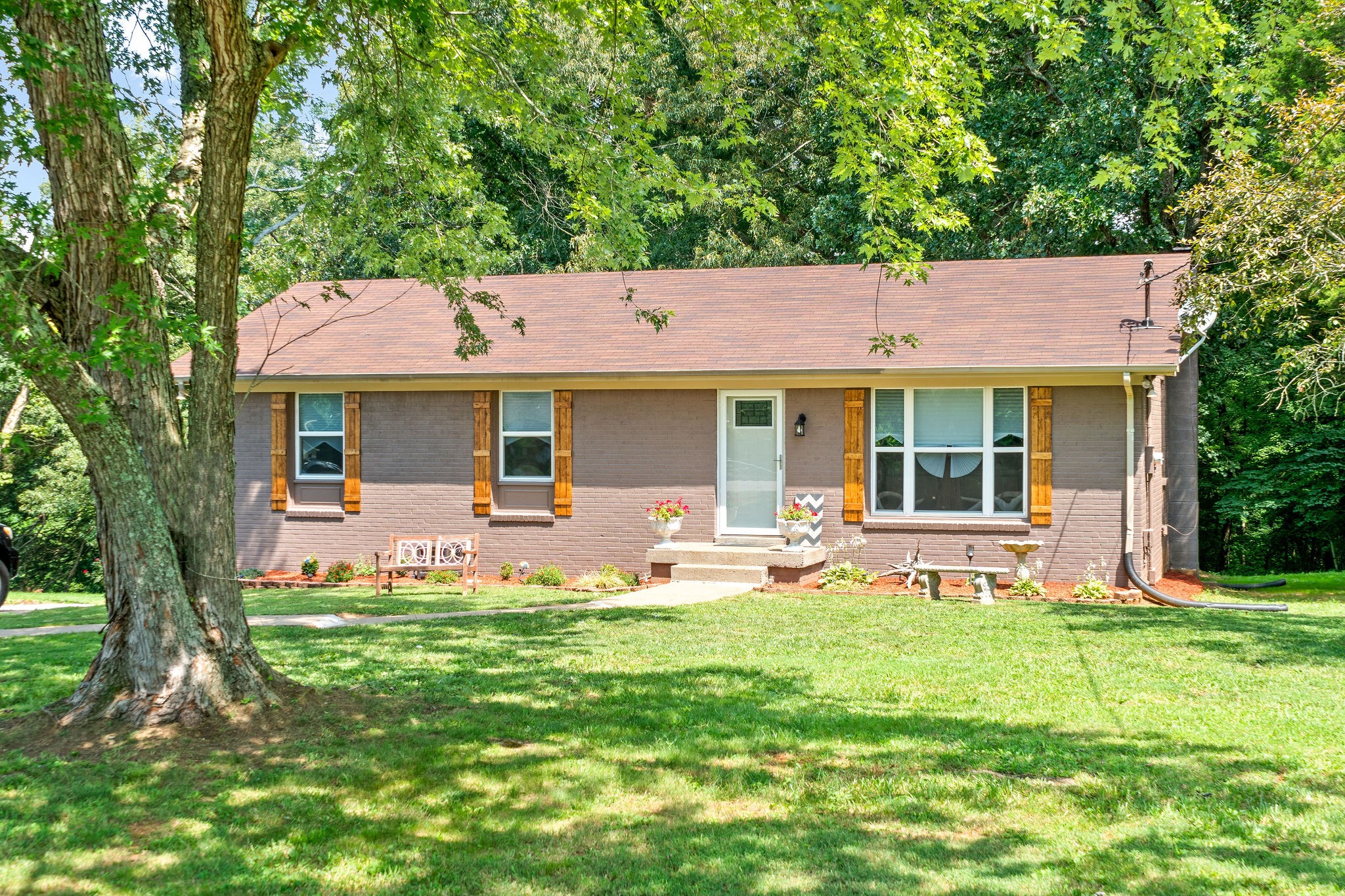 333 Dean Road Clarksville, TN 37040 - Photo 3 of 30 a front view of a house with a garden and porch