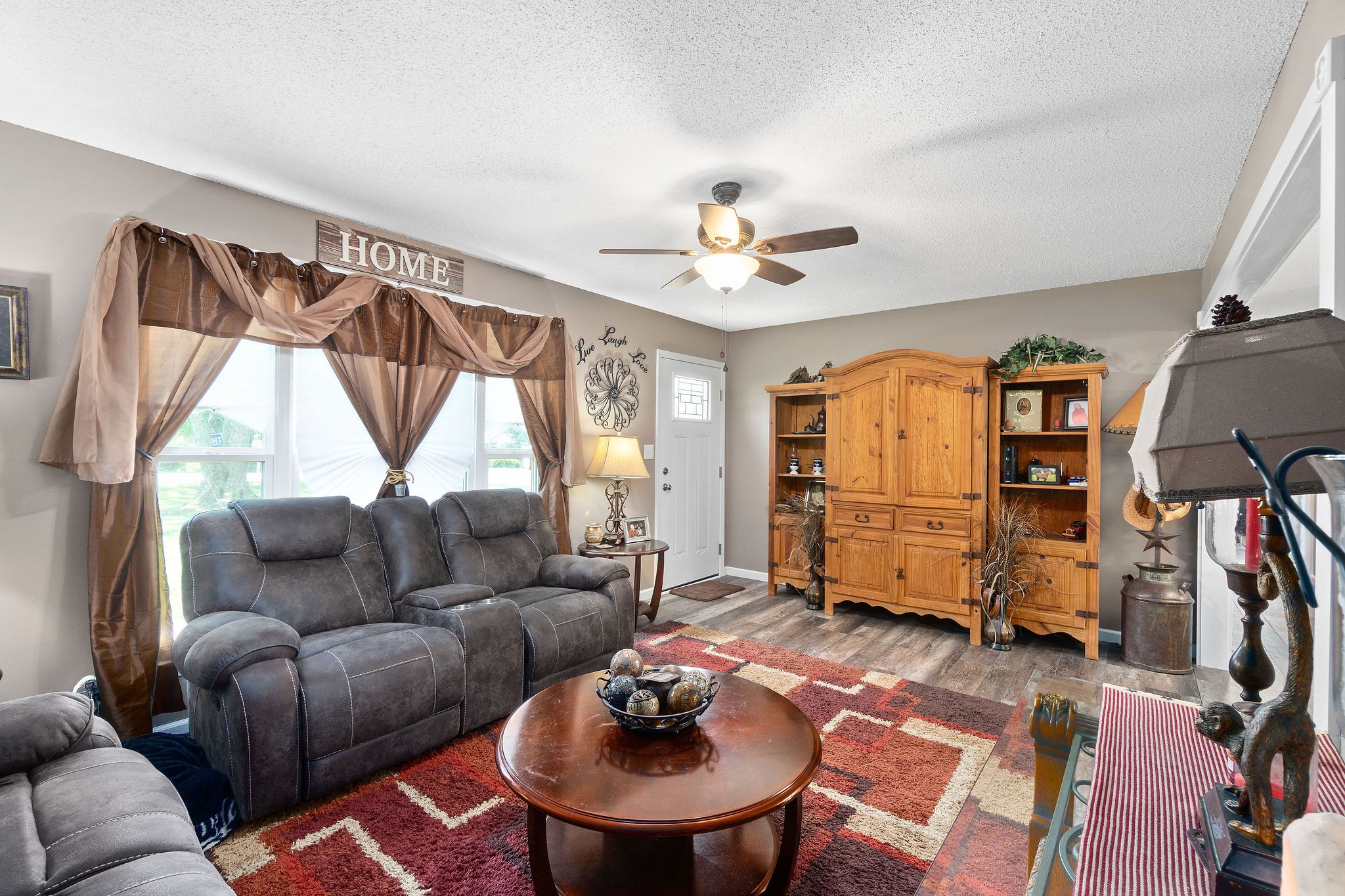 333 Dean Road Clarksville, TN 37040 - Photo 8 of 30 a living room with furniture a ceiling fan and a window