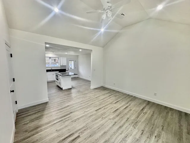 a view of a livingroom with wooden floor