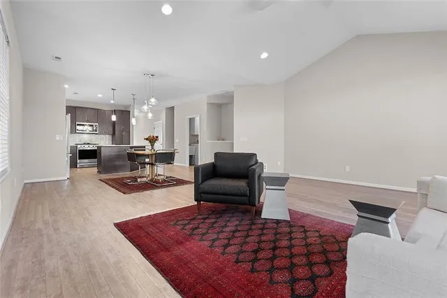 a living room with furniture and a rug