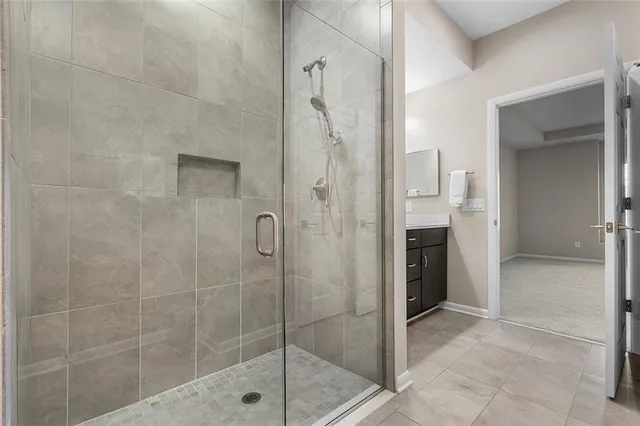 a bathroom with a shower and a sink
