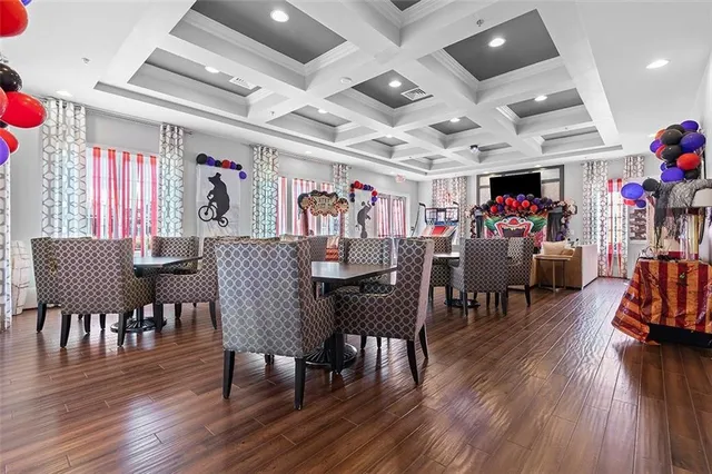 a view of a dining area with furniture and wooden floor