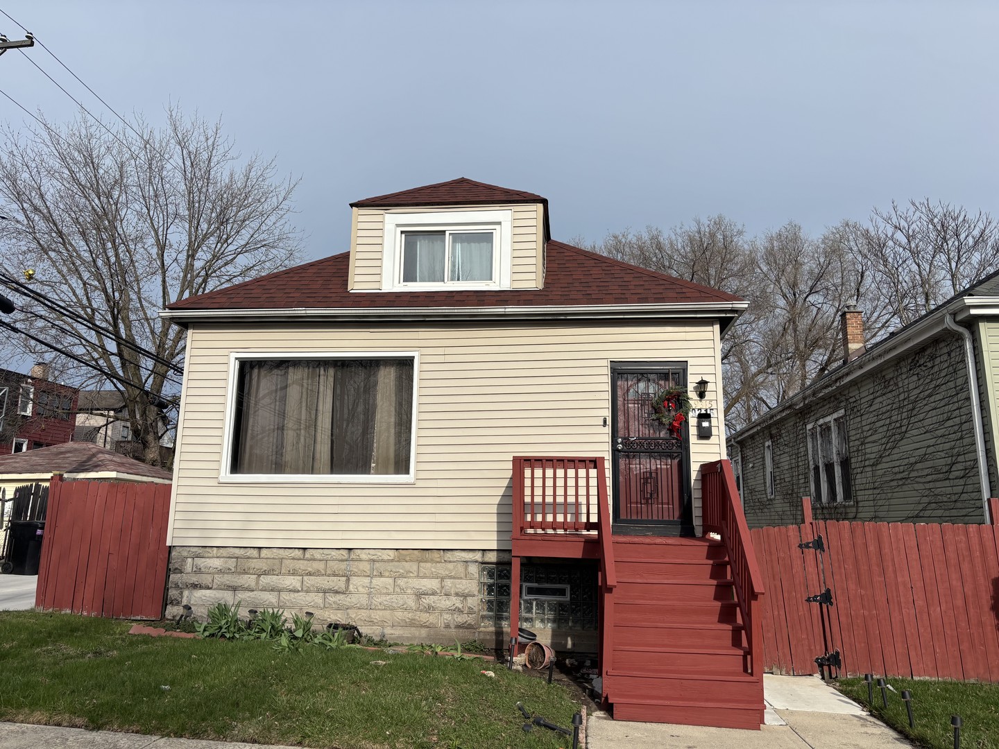 9315 South Clyde Avenue Chicago, IL 60617 - Photo 1 of 1 a front view of a house with a yard