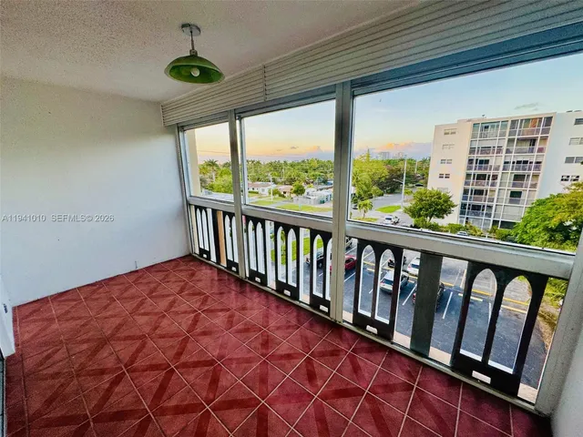 a balcony with wooden floor