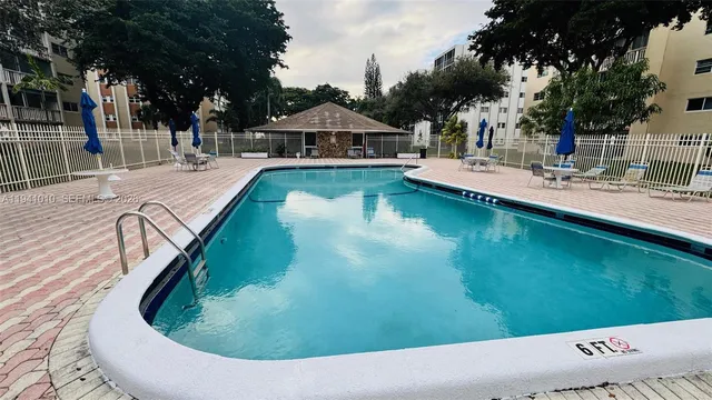 a view of a swimming pool with a patio