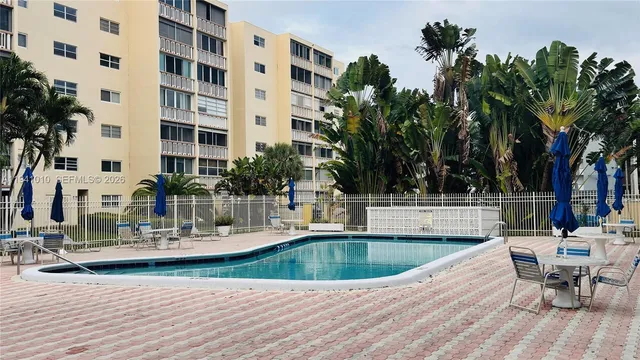 a view of a swimming pool with a patio