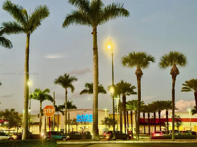 a view of a swimming pool with outdoor seating