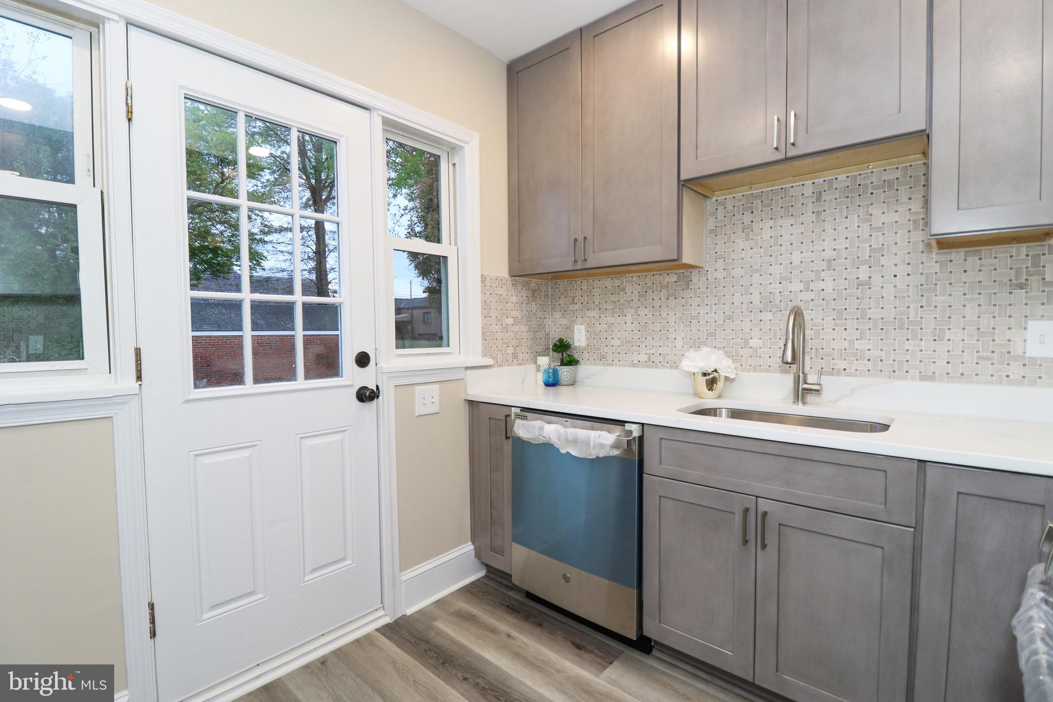 306 Lanark Way Silver Spring, MD 20901 - Photo 14 of 47 Kitchen Leading to Side Yard Perfect for Grilling!
