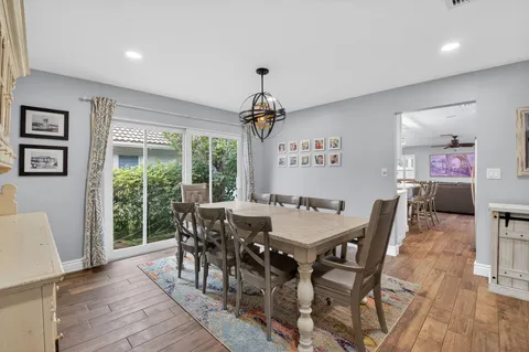 a bedroom with a bed a window and a flat screen television