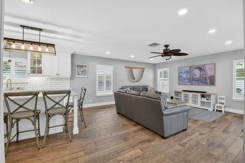 a large kitchen with granite countertop lots of counter space and window