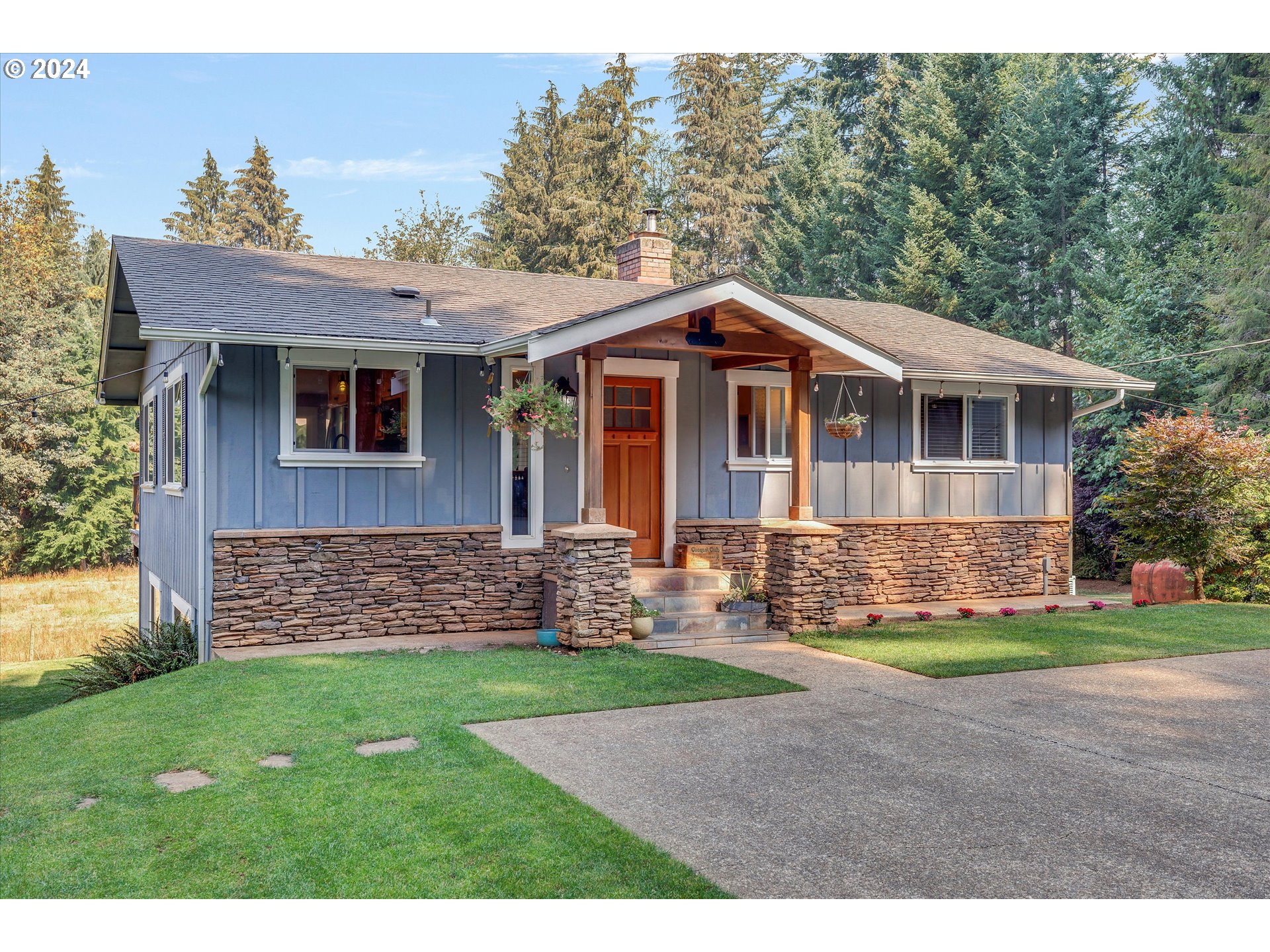 8431 Southeast Groce Road Corbett, OR 97019 - Photo 1 of 37 a front view of a house with a yard