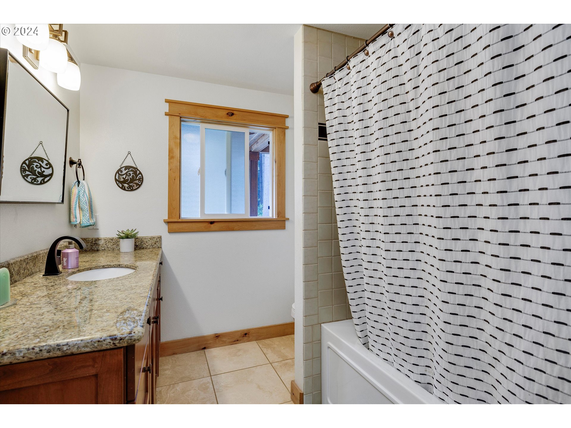 8431 Southeast Groce Road Corbett, OR 97019 - Photo 13 of 37 a bathroom with a granite countertop sink and a mirror