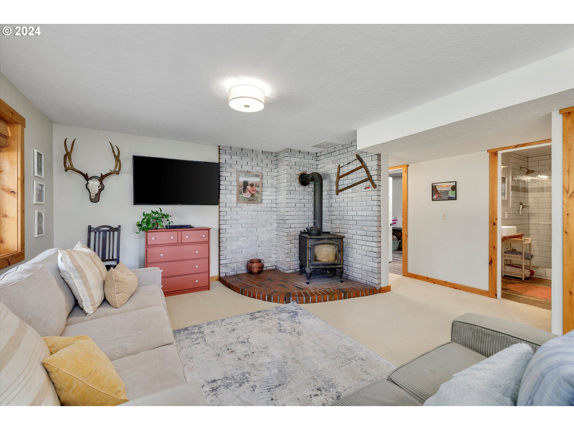 8431 Southeast Groce Road Corbett, OR 97019 - Photo 16 of 37 a living room with furniture and a flat screen tv