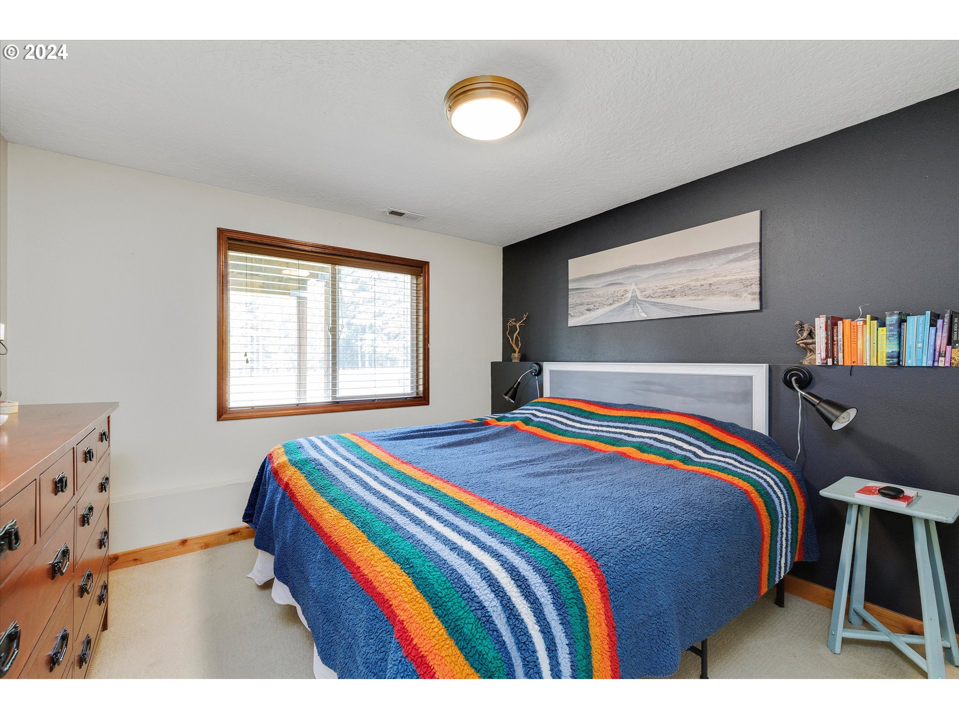 8431 Southeast Groce Road Corbett, OR 97019 - Photo 17 of 37 a bedroom with a bed and window