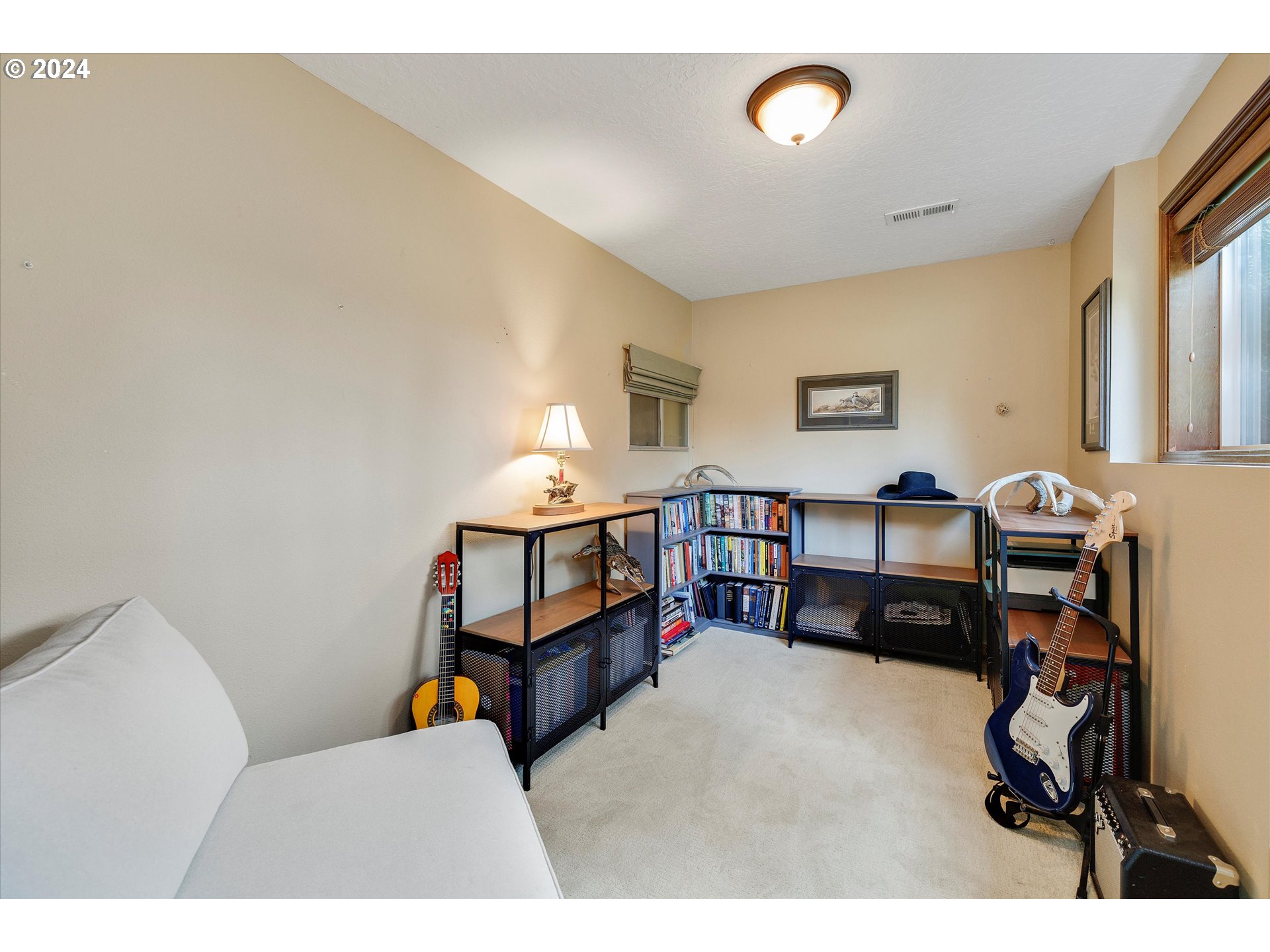 8431 Southeast Groce Road Corbett, OR 97019 - Photo 19 of 37 a bed room with furniture and a window