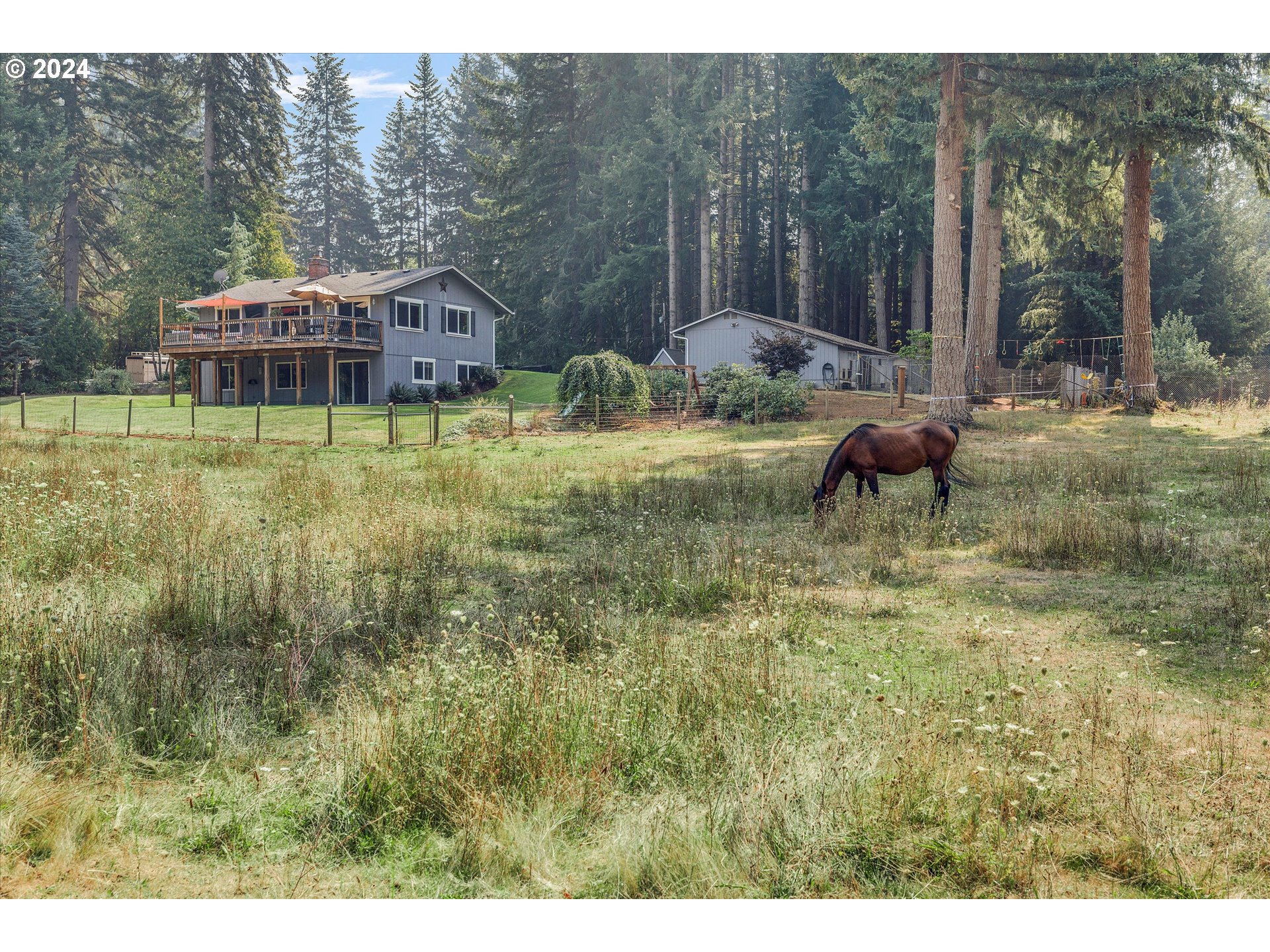 8431 Southeast Groce Road Corbett, OR 97019 - Photo 22 of 37 a view of a house with a yard and sitting area