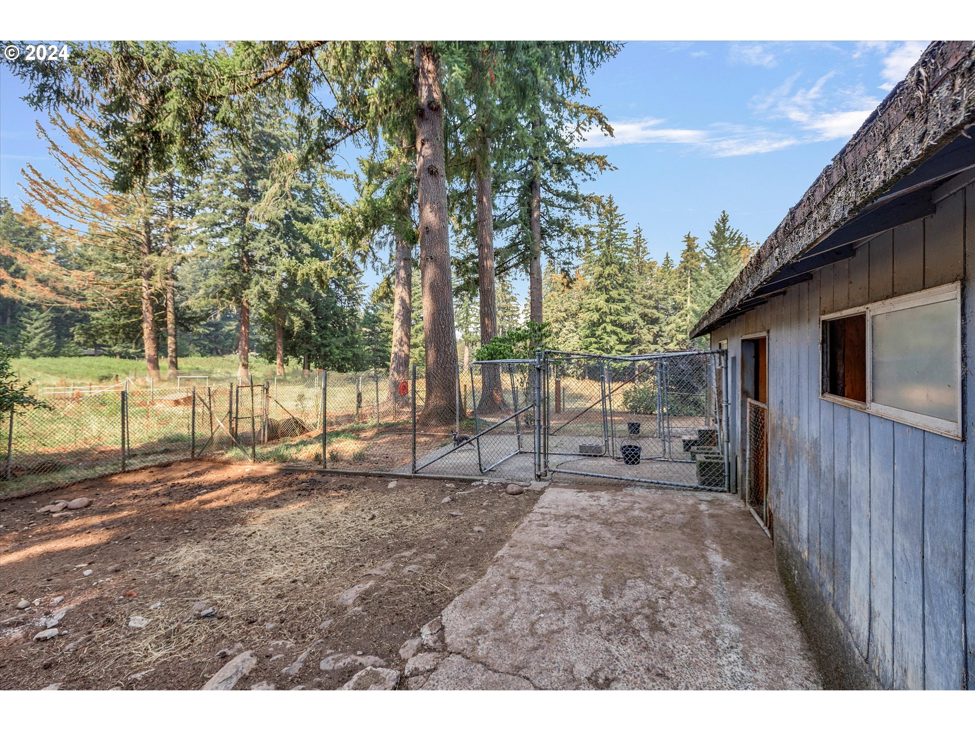 8431 Southeast Groce Road Corbett, OR 97019 - Photo 26 of 37 a backyard of a house with table and chairs