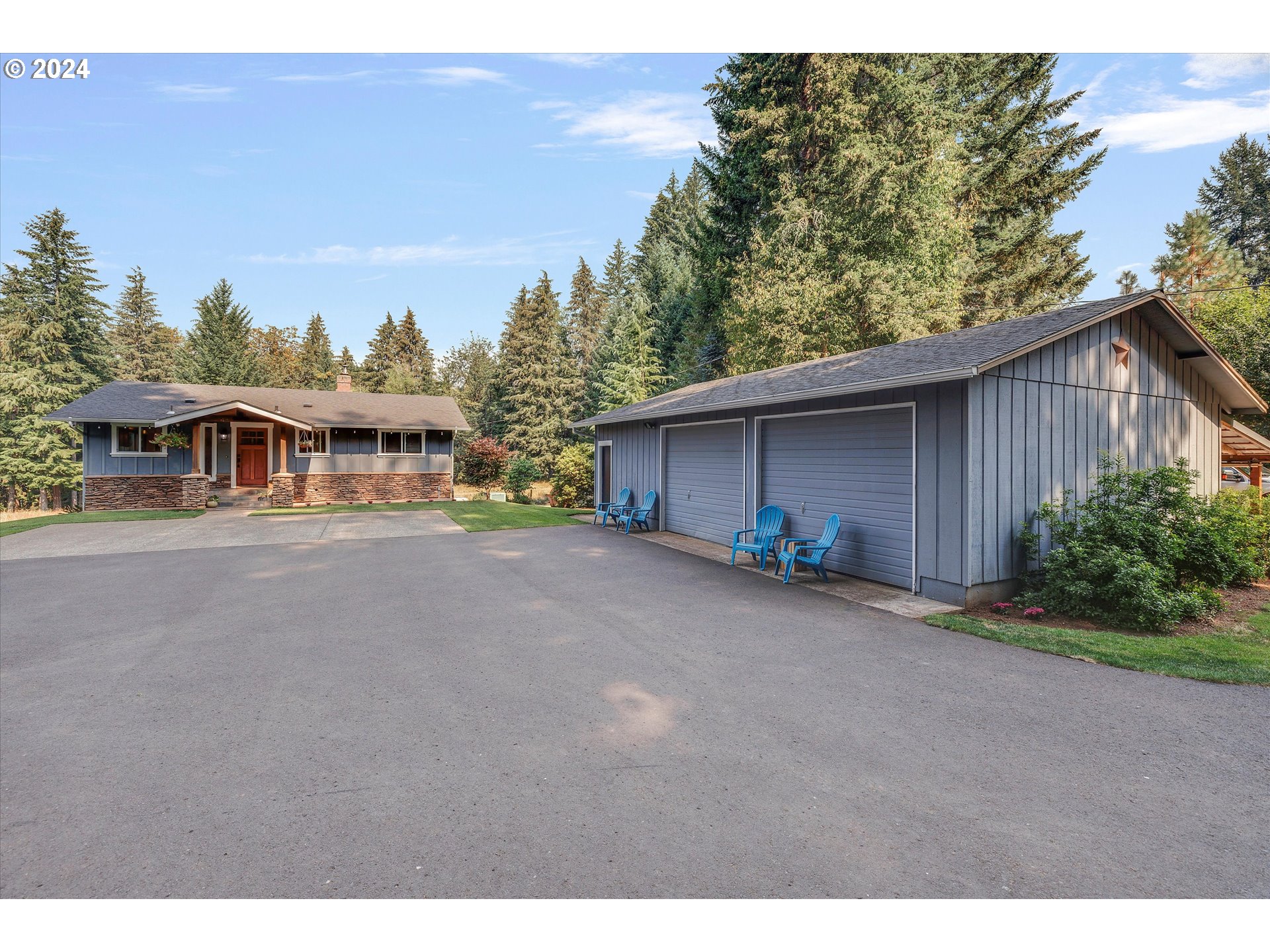 8431 Southeast Groce Road Corbett, OR 97019 - Photo 36 of 37 a view of a house with a yard and potted plants