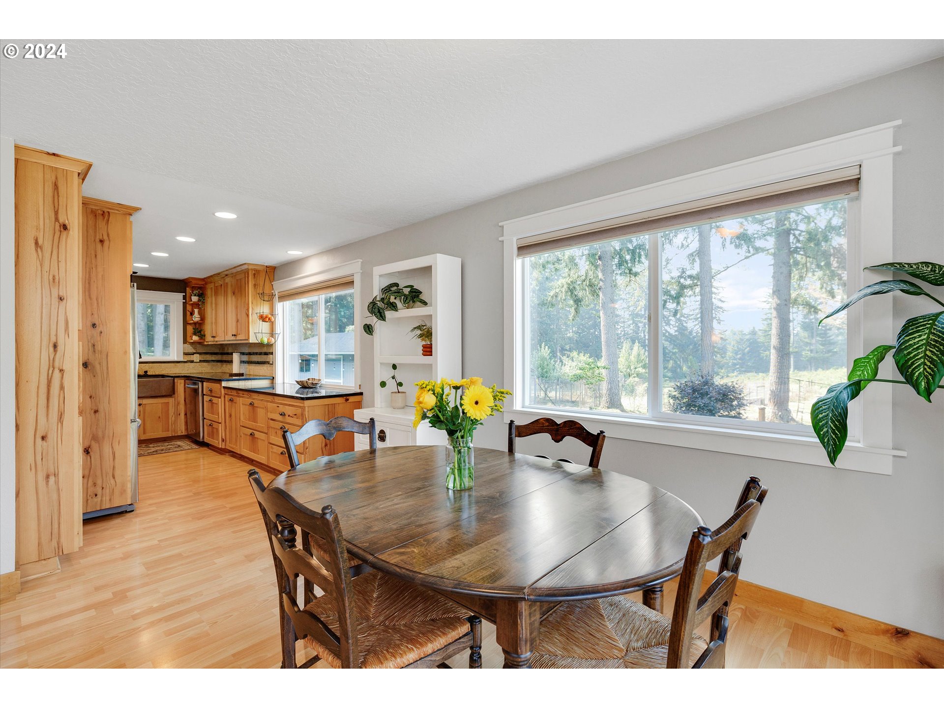 8431 Southeast Groce Road Corbett, OR 97019 - Photo 8 of 37 a view of a dining room with furniture and wooden floor