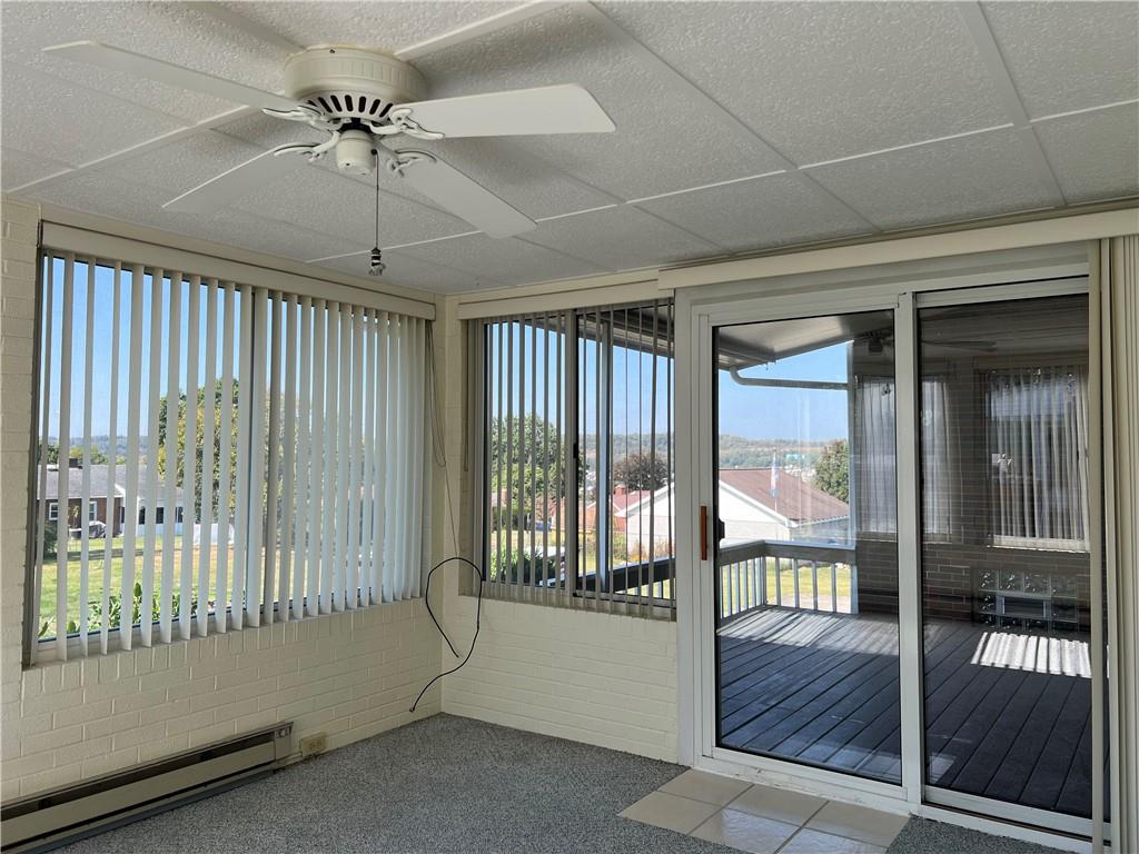 233 Reed Street Lower Burrell, PA 15068 - Photo 16 of 40 Sun room with access to back covered deck.