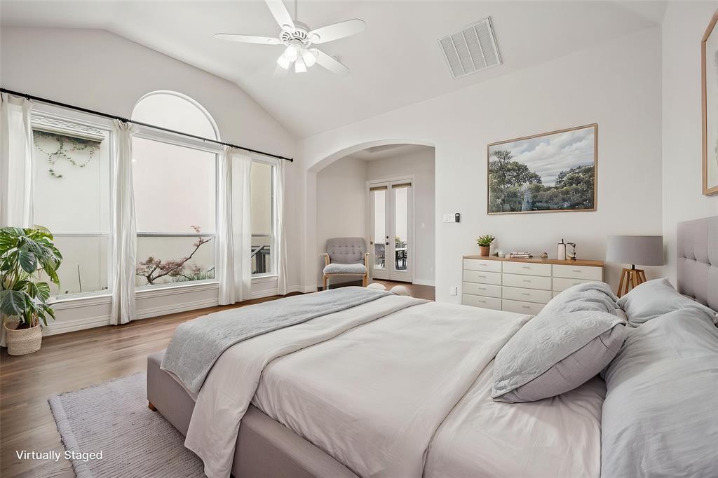 3309 Ricci Lane Irving, TX 75062 - Photo 15 of 36 Bedroom with hardwood floors, sitting room, ceiling fan, and arched walkways