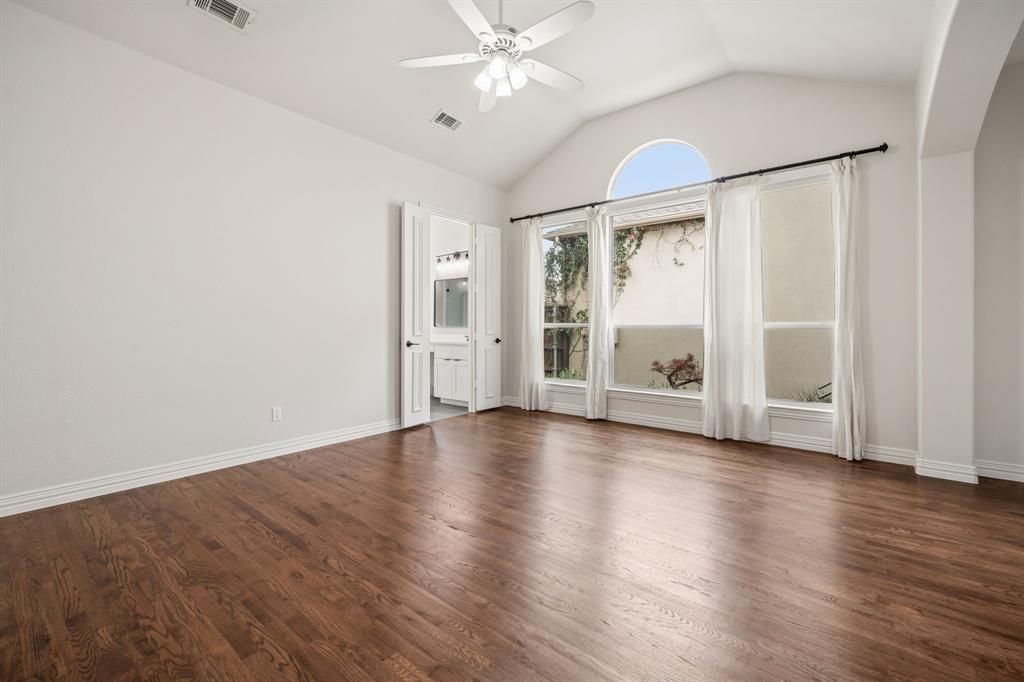 3309 Ricci Lane Irving, TX 75062 - Photo 17 of 36 room with a ceiling fan and dark wood finished floors