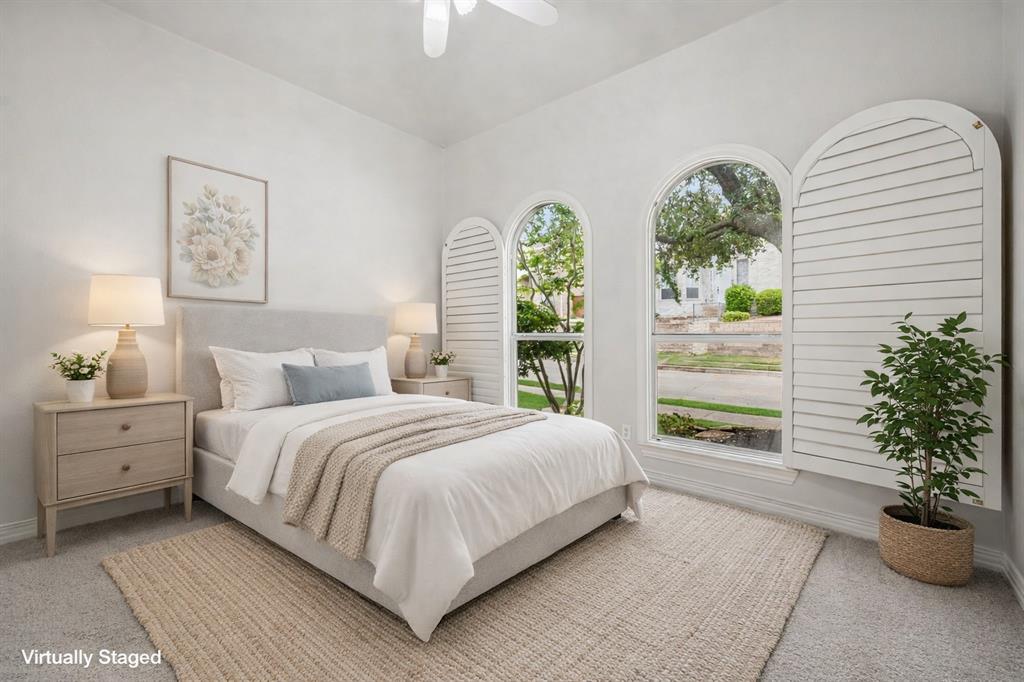 3309 Ricci Lane Irving, TX 75062 - Photo 23 of 36 Bedroom with light carpet and ceiling fan