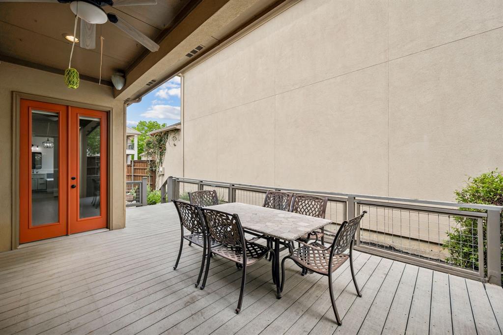 3309 Ricci Lane Irving, TX 75062 - Photo 25 of 36 Wooden terrace featuring french doors, a ceiling fan, and outdoor dining area