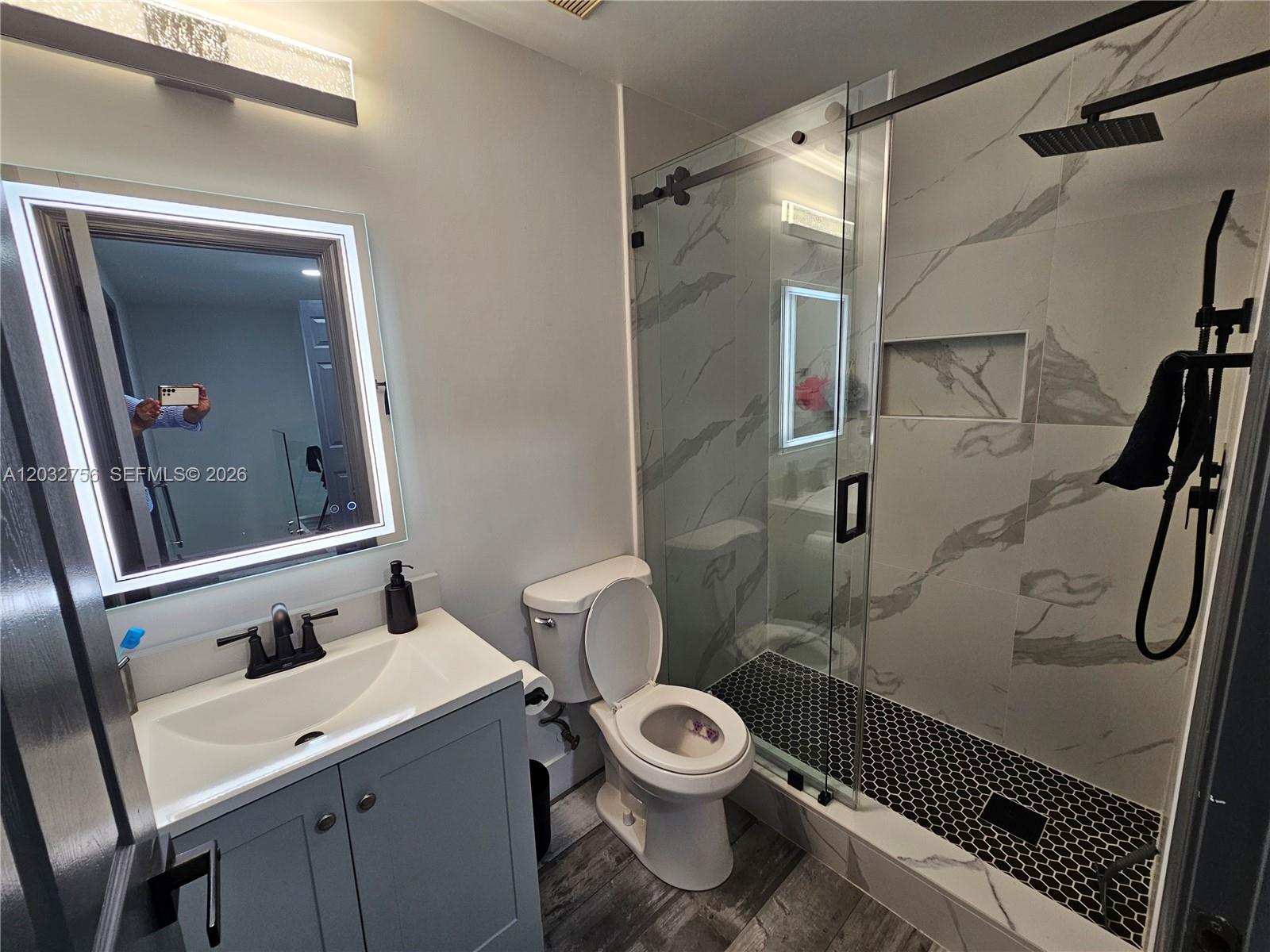 4331 Southwest 124th Way Miramar, FL 33027 - Photo 21 of 40 a white toilet sitting next to a bathroom sink