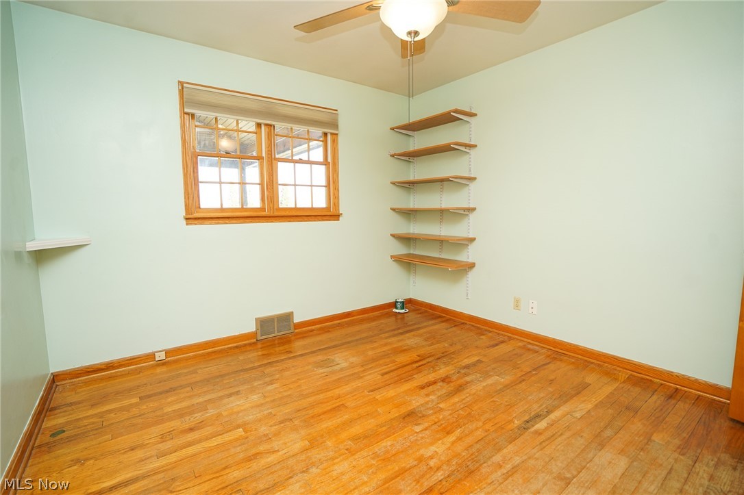 453 Omar Street Struthers, OH 44471 - Photo 20 of 27 Spare room with light wood finished floors and a ceiling fan