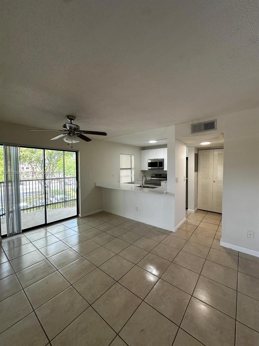 3400 Foxcroft Road, Unit 301 Miramar, FL 33025 - Photo 10 of 72 a view of a kitchen with furniture and a kitchen