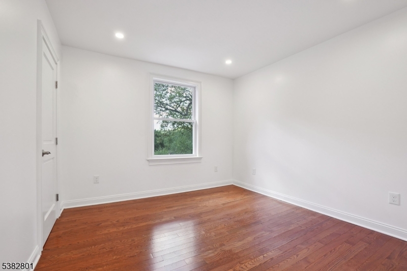75 Chestnut Street Morristown, NJ 07960 - Photo 11 of 16 an empty room with wooden floor and window