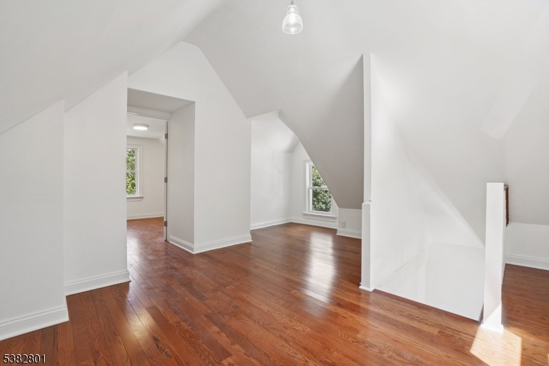 75 Chestnut Street Morristown, NJ 07960 - Photo 12 of 16 a view of an empty room with wooden floor