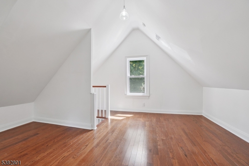 75 Chestnut Street Morristown, NJ 07960 - Photo 13 of 16 an empty room with wooden floor and windows