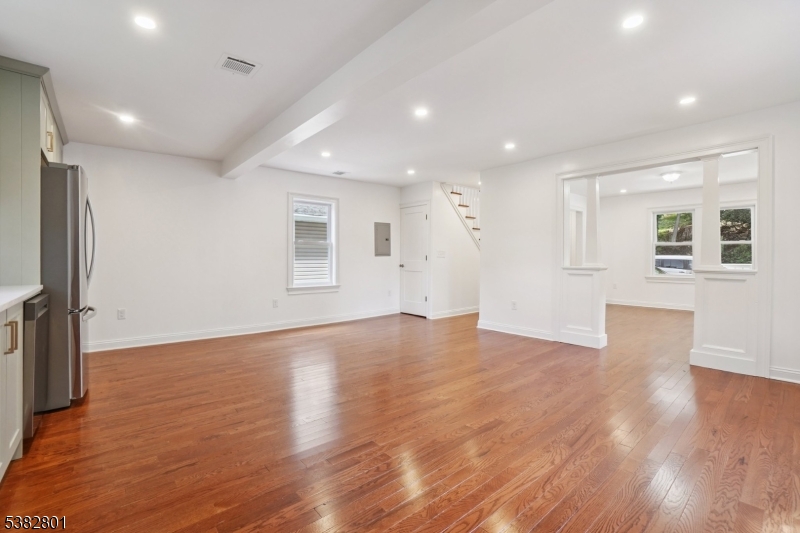 75 Chestnut Street Morristown, NJ 07960 - Photo 3 of 16 a view of an empty room with wooden floor and a window