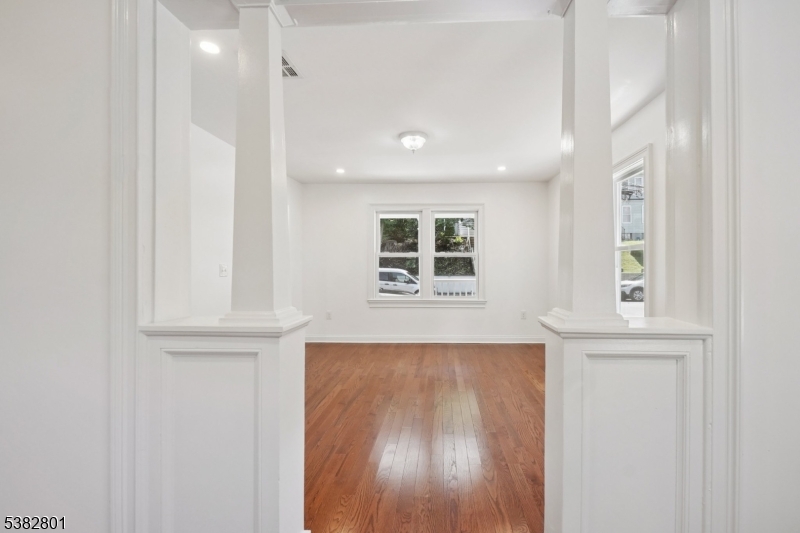 75 Chestnut Street Morristown, NJ 07960 - Photo 6 of 16 an entryway with wooden floor and cabinet