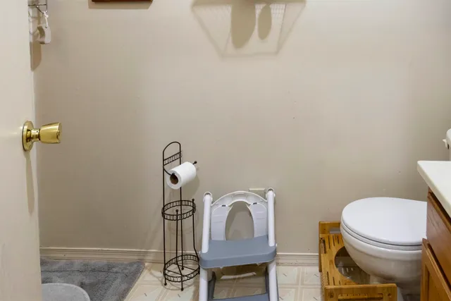 a kitchen with a stove a sink and a window