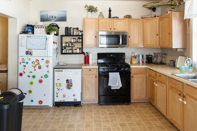 a bedroom with furniture and a fireplace