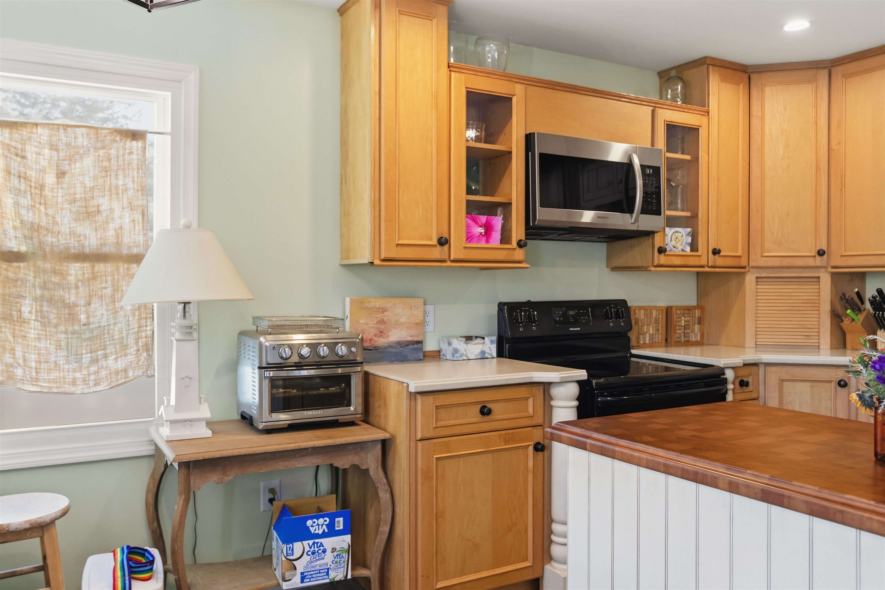 1001 Highway 47 Rio Grande, NJ 08242 - Photo 10 of 37 a kitchen with stainless steel appliances a stove a microwave sink and cabinets