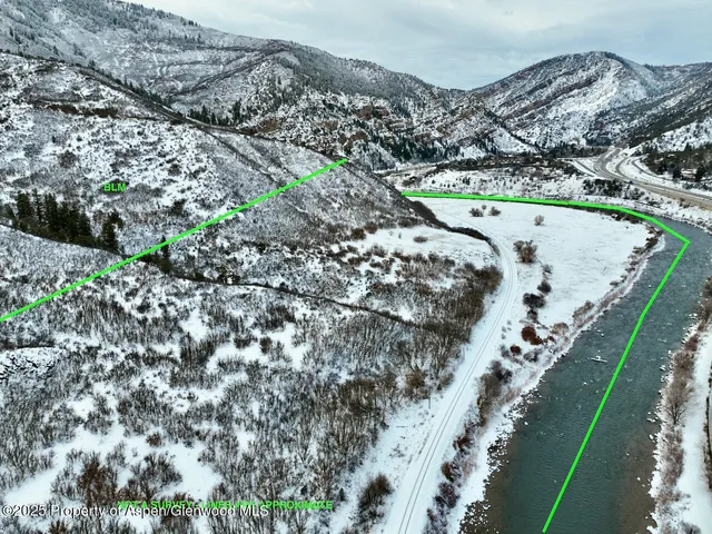 a view of a water with a mountain in the background