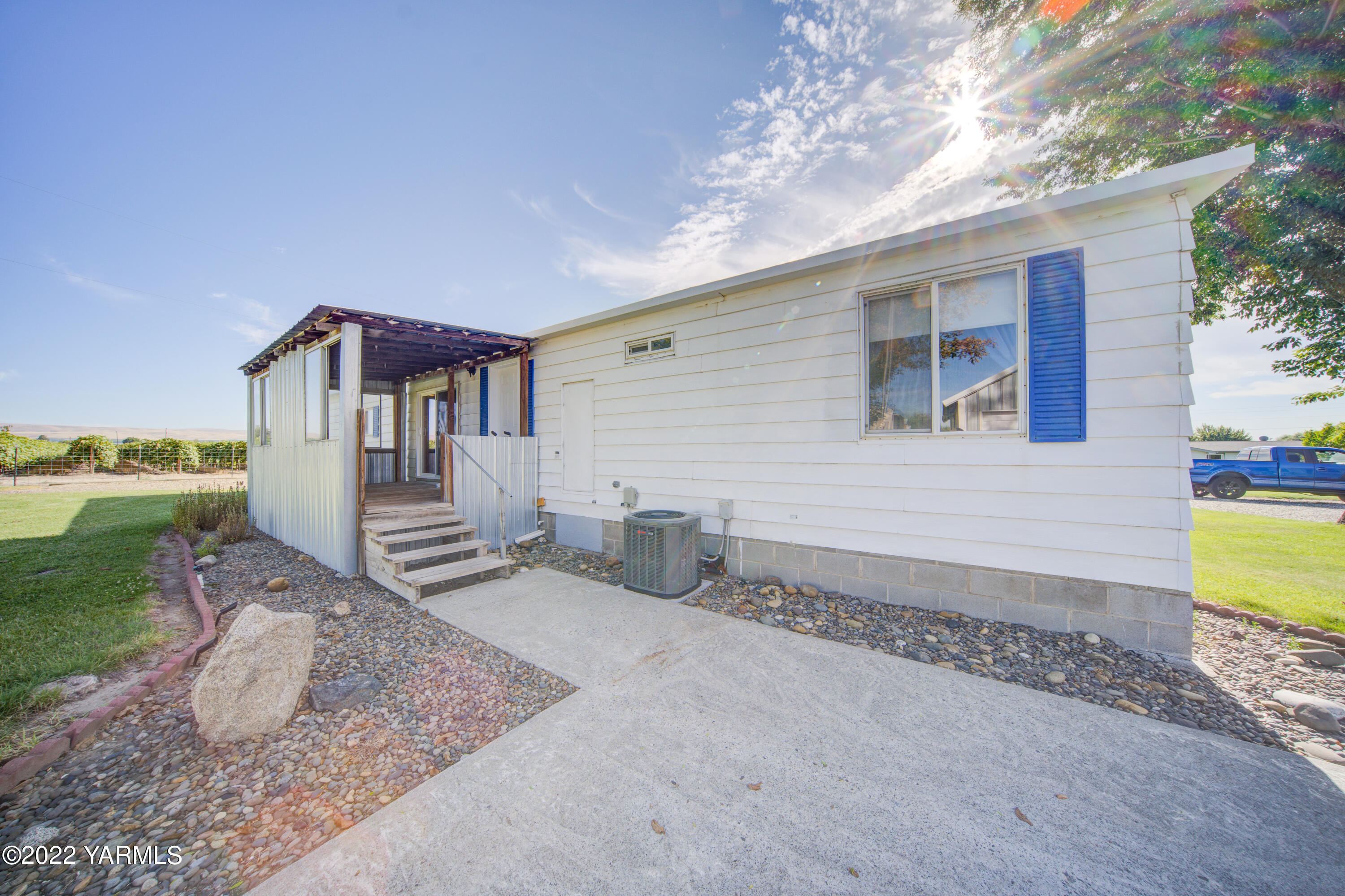 2541 Scoon Road Sunnyside, WA 98944 - Photo 27 of 27 a view of a house with backyard and wooden fence